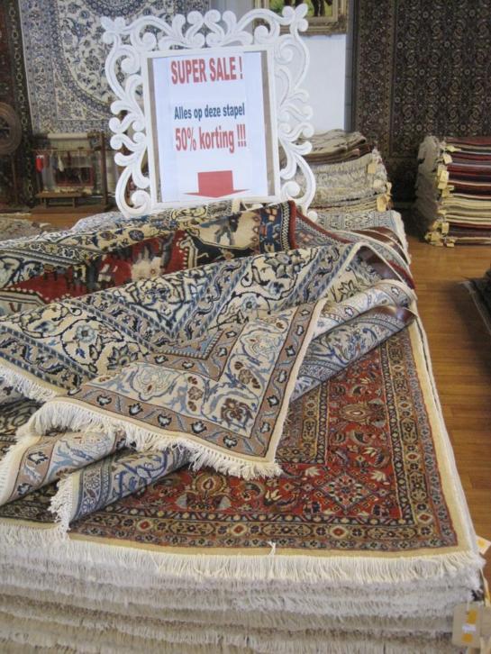 Magazijn opruiming Perzische tapijten 50% korting!